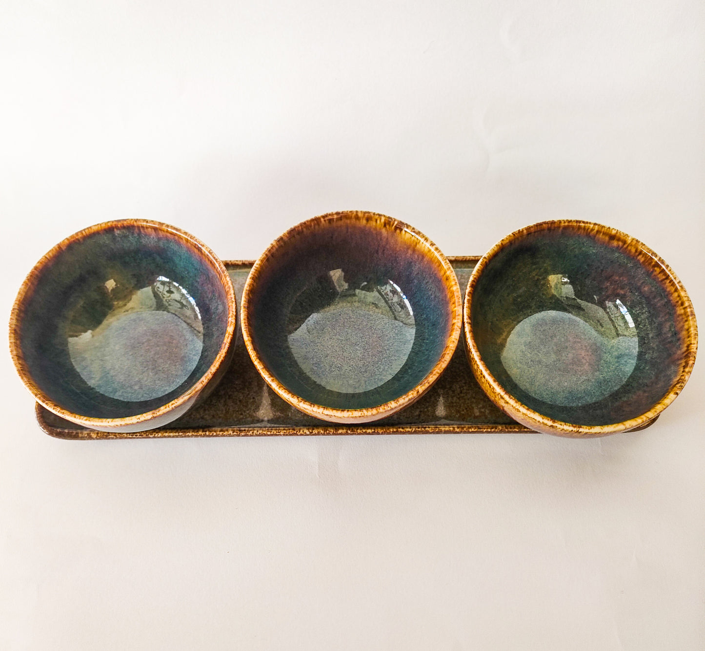 Plate with 3 small bowls.